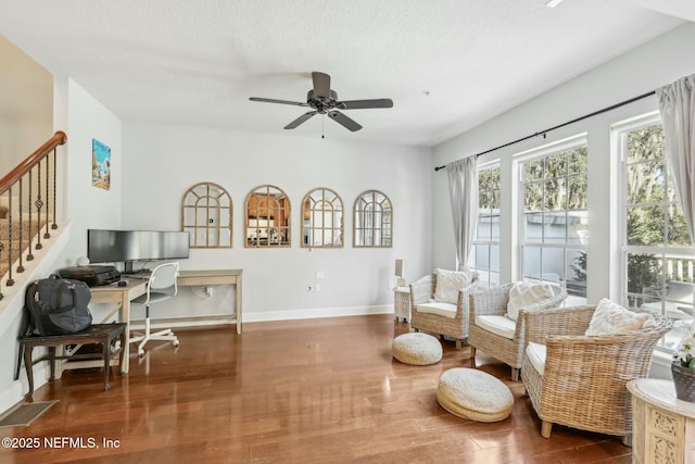 sitting room featuring ceiling fan, a textured ceiling, and dark hardwood / wood-style flooring