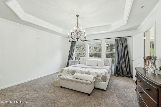 bedroom with light colored carpet, a textured ceiling, a raised ceiling, and a chandelier