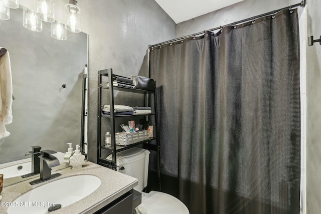 full bathroom with toilet, vanity, and shower / bath combo with shower curtain