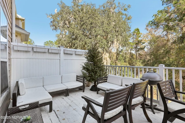 wooden deck featuring an outdoor living space