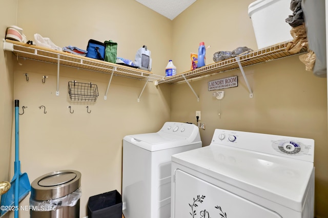 washroom featuring washing machine and dryer