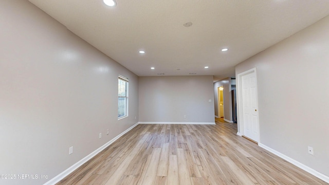 empty room with light wood-type flooring