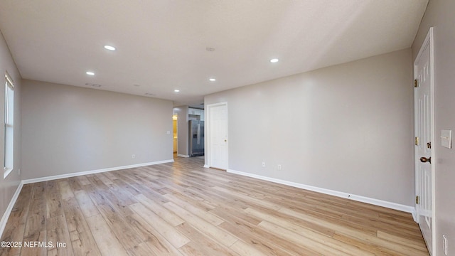 empty room with light wood-type flooring