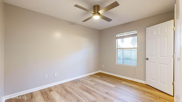 empty room featuring ceiling fan and light hardwood / wood-style flooring