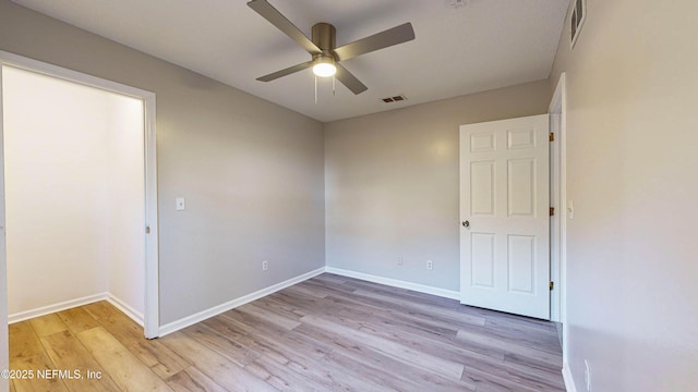 unfurnished room with light hardwood / wood-style floors and ceiling fan