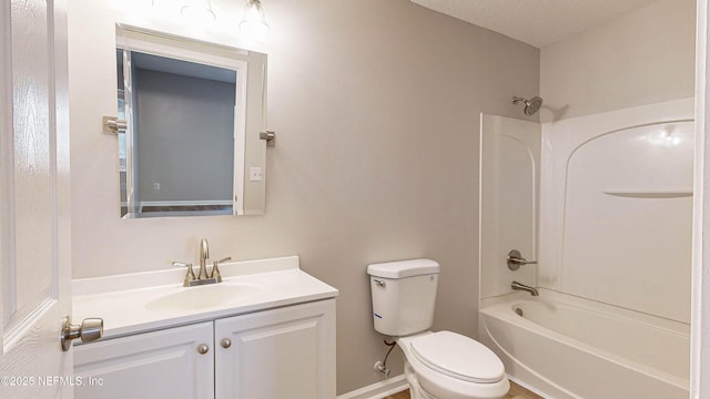 full bathroom featuring toilet, vanity, a textured ceiling, and washtub / shower combination