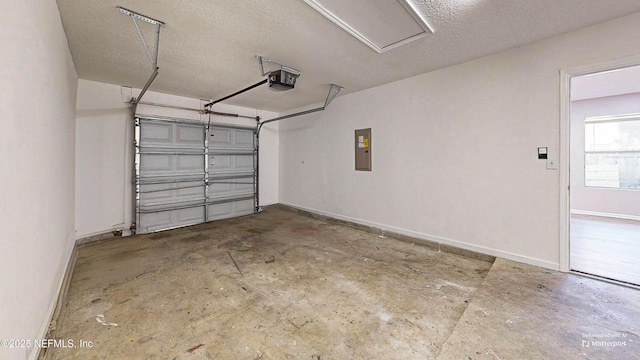 garage featuring electric panel and a garage door opener