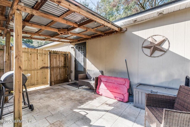 view of patio / terrace with grilling area and ceiling fan