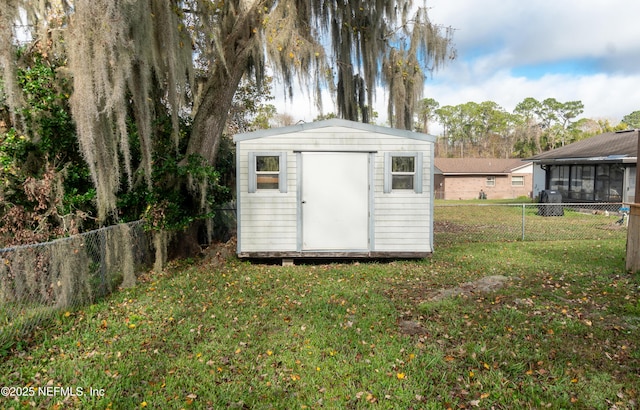 view of outdoor structure featuring a yard