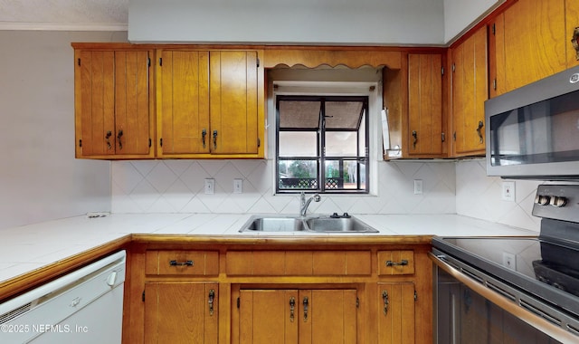 kitchen with tasteful backsplash, dishwasher, sink, and black range with electric cooktop