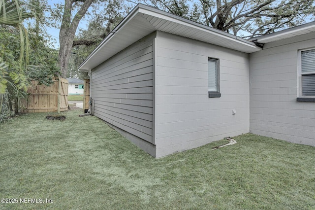 view of property exterior featuring a lawn