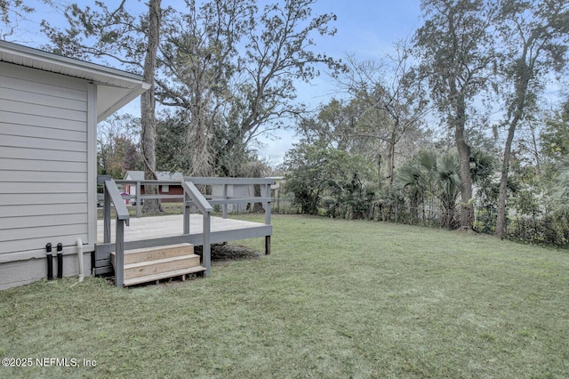 view of yard featuring a wooden deck