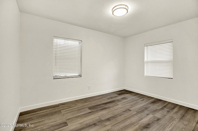 spare room featuring hardwood / wood-style flooring