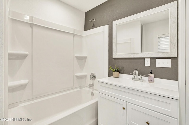 bathroom with vanity and washtub / shower combination