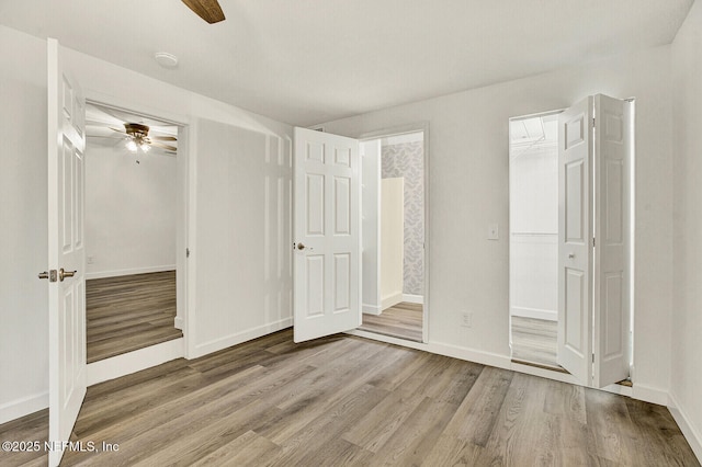 unfurnished bedroom featuring ceiling fan and light hardwood / wood-style floors