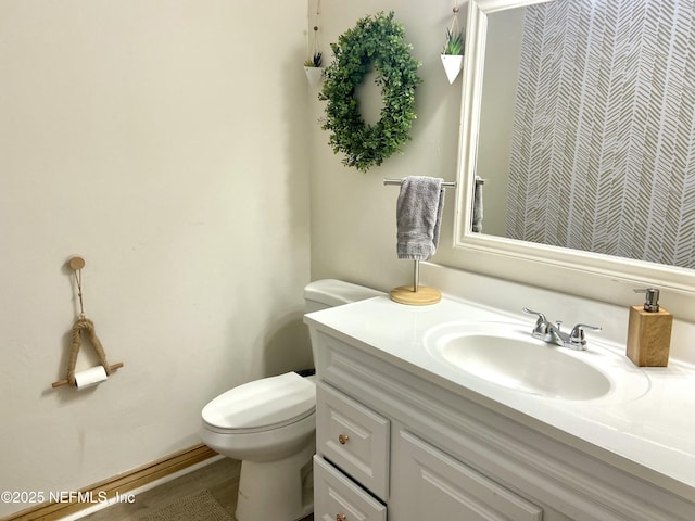 bathroom with vanity and toilet