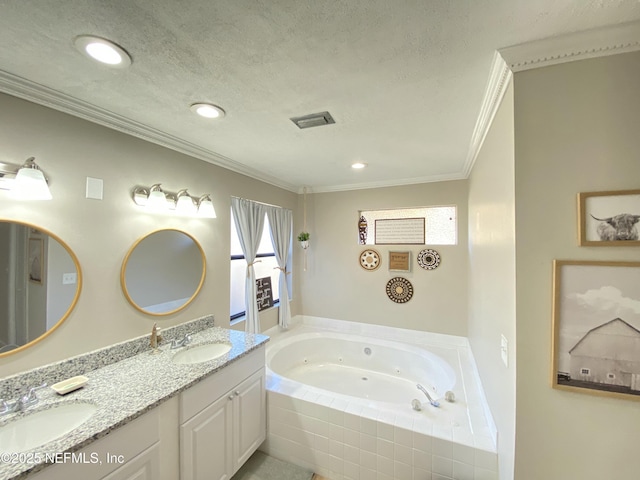 bathroom with vanity, crown molding, a relaxing tiled tub, and a textured ceiling