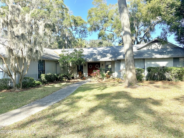 ranch-style home with a front lawn