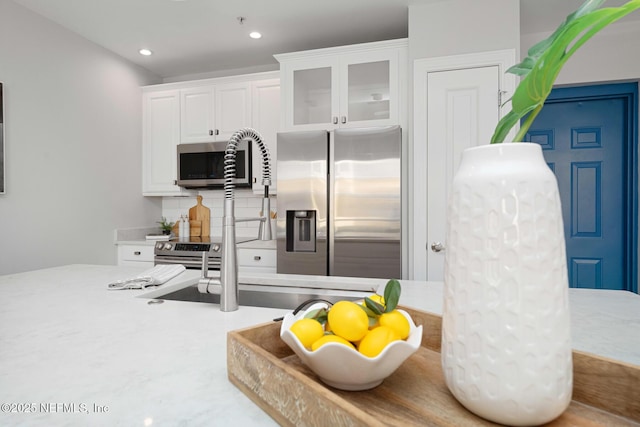 kitchen featuring white cabinets and stainless steel appliances