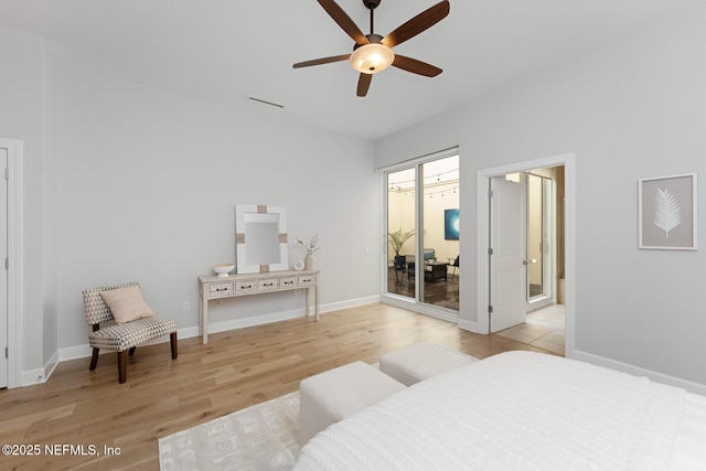 bedroom with access to exterior, light hardwood / wood-style flooring, and ceiling fan