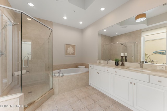 bathroom featuring separate shower and tub, tile patterned flooring, and vanity