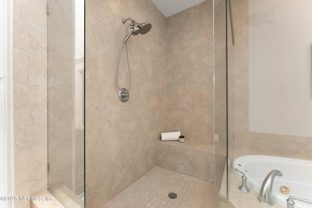 bathroom with separate shower and tub