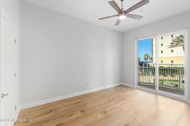 unfurnished room with ceiling fan and light wood-type flooring