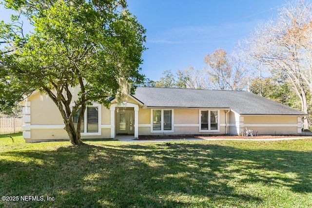 ranch-style house with a front lawn