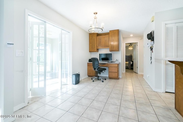 home office featuring a chandelier and light tile patterned flooring