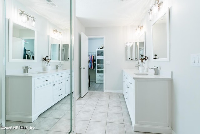 bathroom with tile patterned floors and vanity