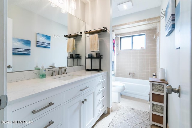 full bathroom with vanity, toilet, and tiled shower / bath combo