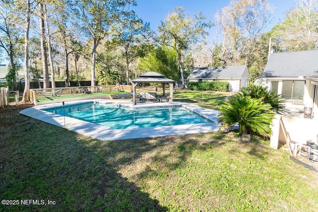 view of pool featuring a lawn, a gazebo, and an outbuilding