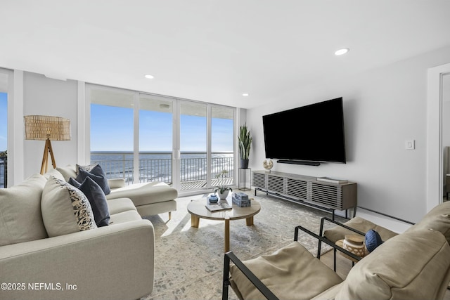 living room with floor to ceiling windows