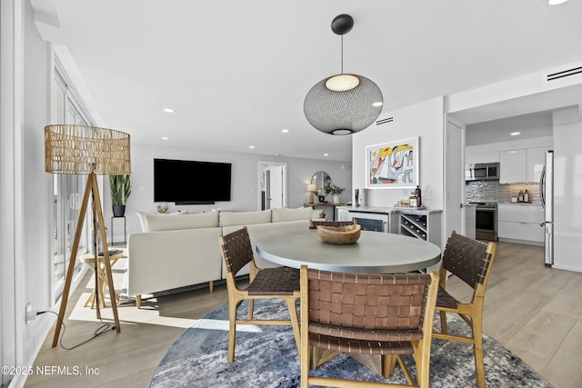 dining area with light wood-type flooring