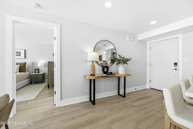 entryway with light hardwood / wood-style floors