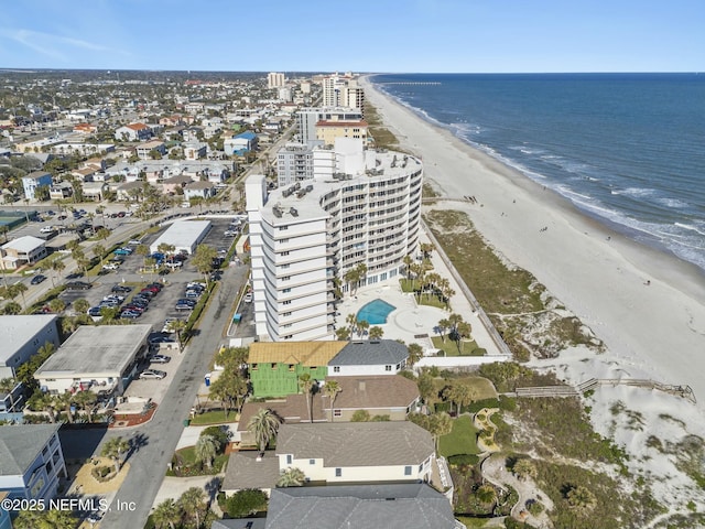 aerial view featuring a view of the beach and a water view