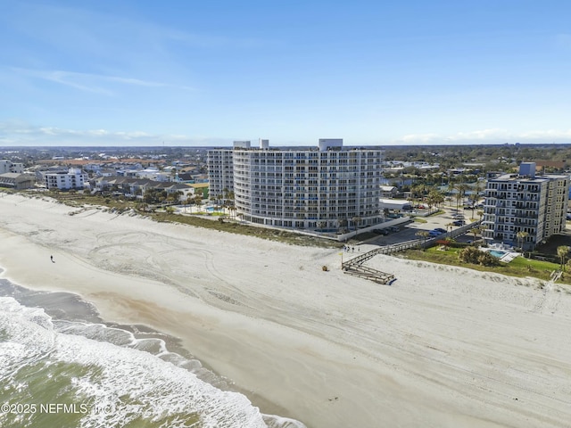 aerial view featuring a water view and a beach view