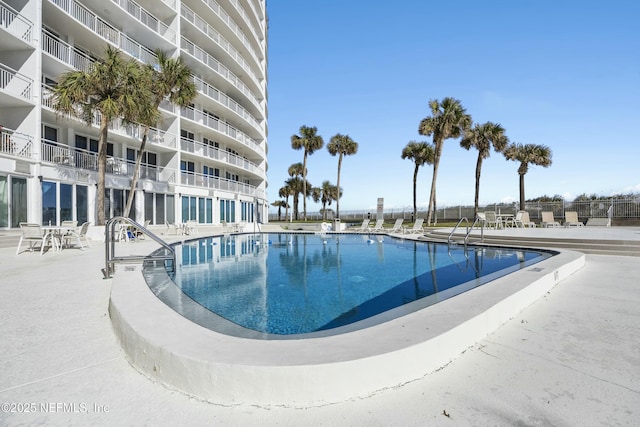 view of swimming pool with a patio