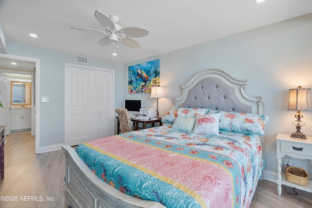 bedroom featuring ceiling fan, light hardwood / wood-style floors, and a closet