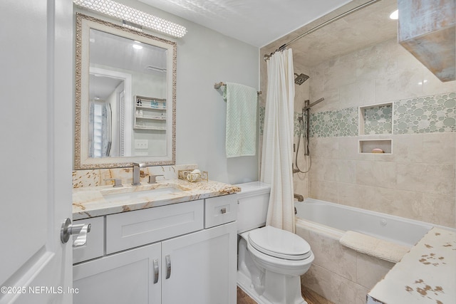 full bathroom with vanity, shower / bathtub combination with curtain, and toilet