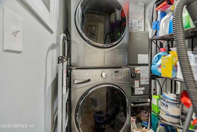 clothes washing area with stacked washer / drying machine