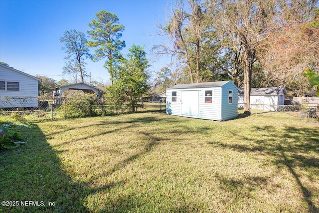 view of yard featuring a storage unit