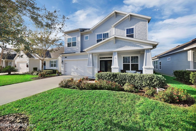 craftsman inspired home featuring a garage and a front lawn