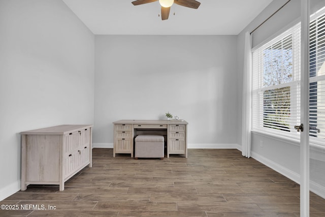 interior space with ceiling fan