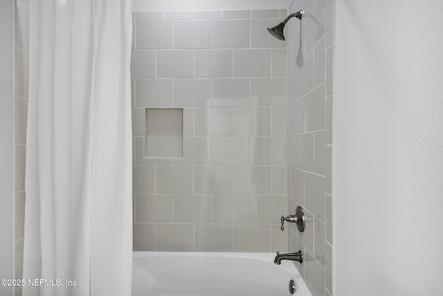 bathroom featuring shower / bath combo with shower curtain