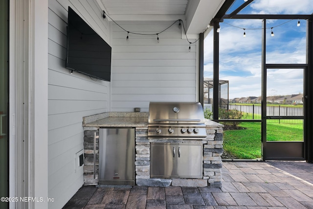 view of patio / terrace with area for grilling and an outdoor kitchen