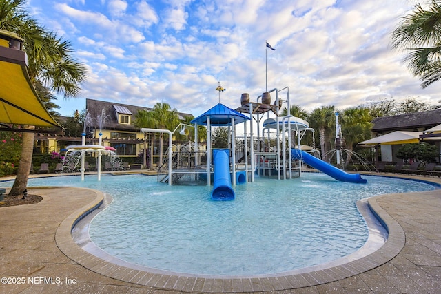 view of pool featuring a playground