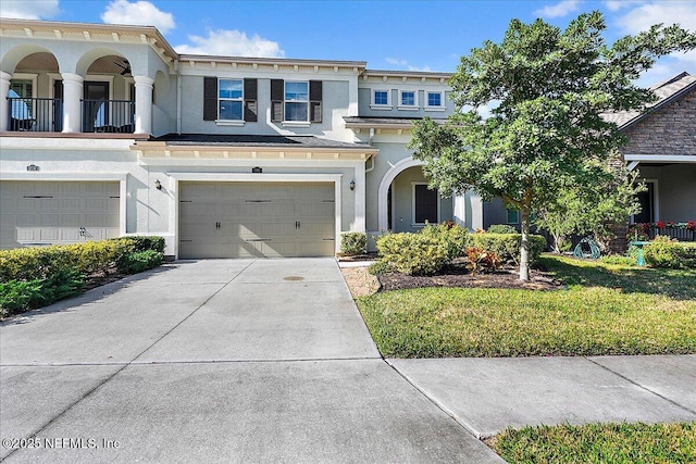 view of front facade featuring a front lawn and a garage