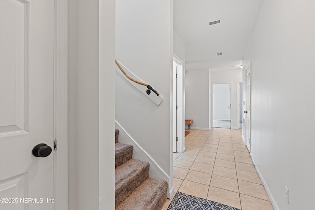 stairway featuring tile patterned floors