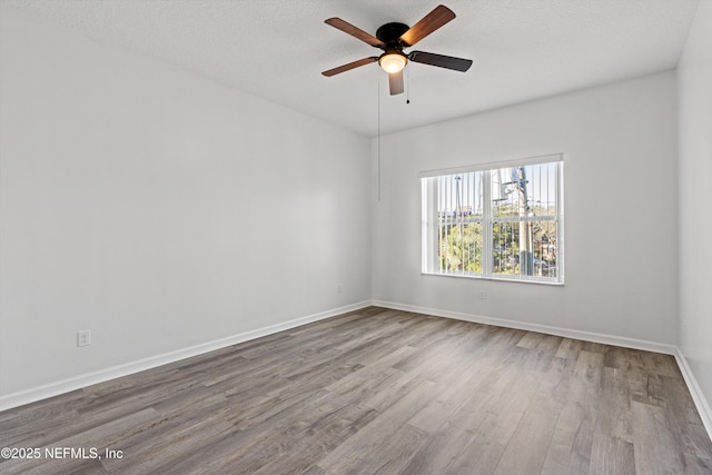 unfurnished room featuring ceiling fan, a textured ceiling, and light hardwood / wood-style flooring